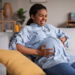 pregnant-black-female-suffering-from-pain-having-painful-spasm-indoors_116547-33739 (1)
