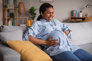 pregnant-black-female-suffering-from-pain-having-painful-spasm-indoors_116547-33739 (1)